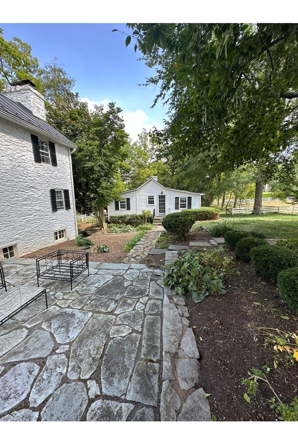 Flagstone patio and path among garden beds
