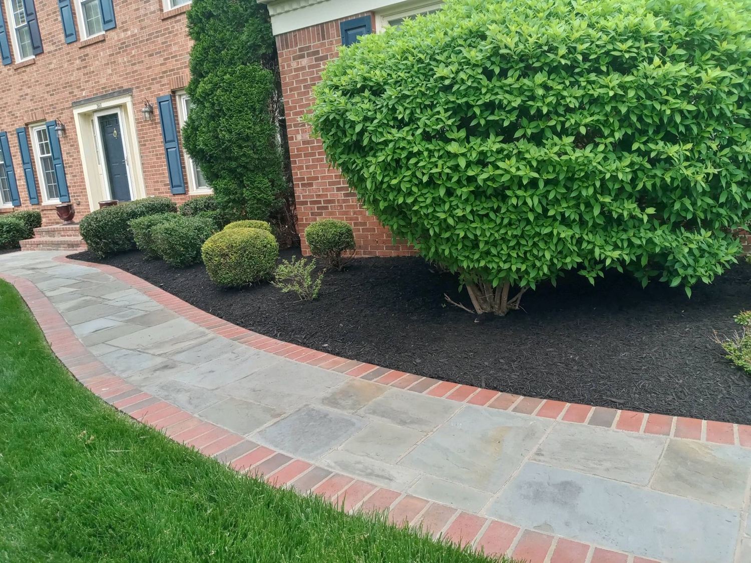 Flagstone walk edged in brick