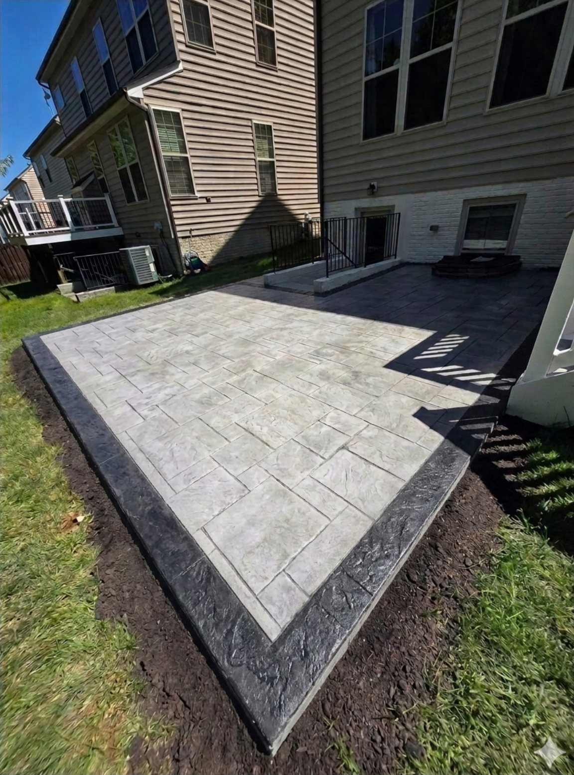 Stamped concrete patio with a dark border
