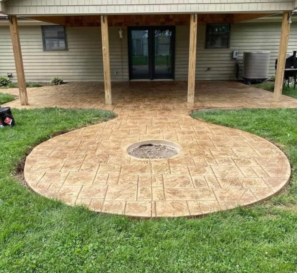 Round stamped patio with a fire ring