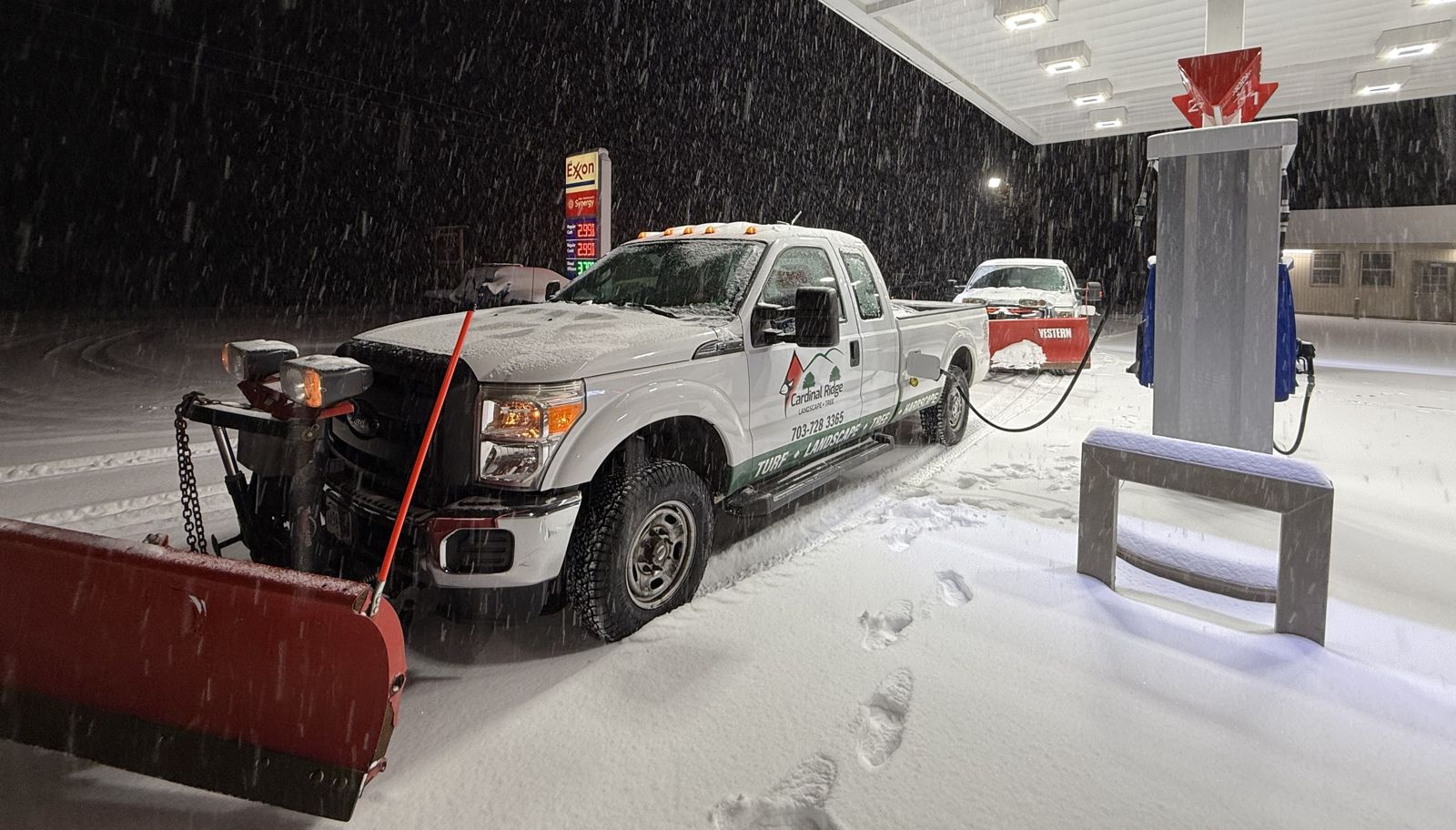 Two Cardinal Ridge plow trucks in heavy snow