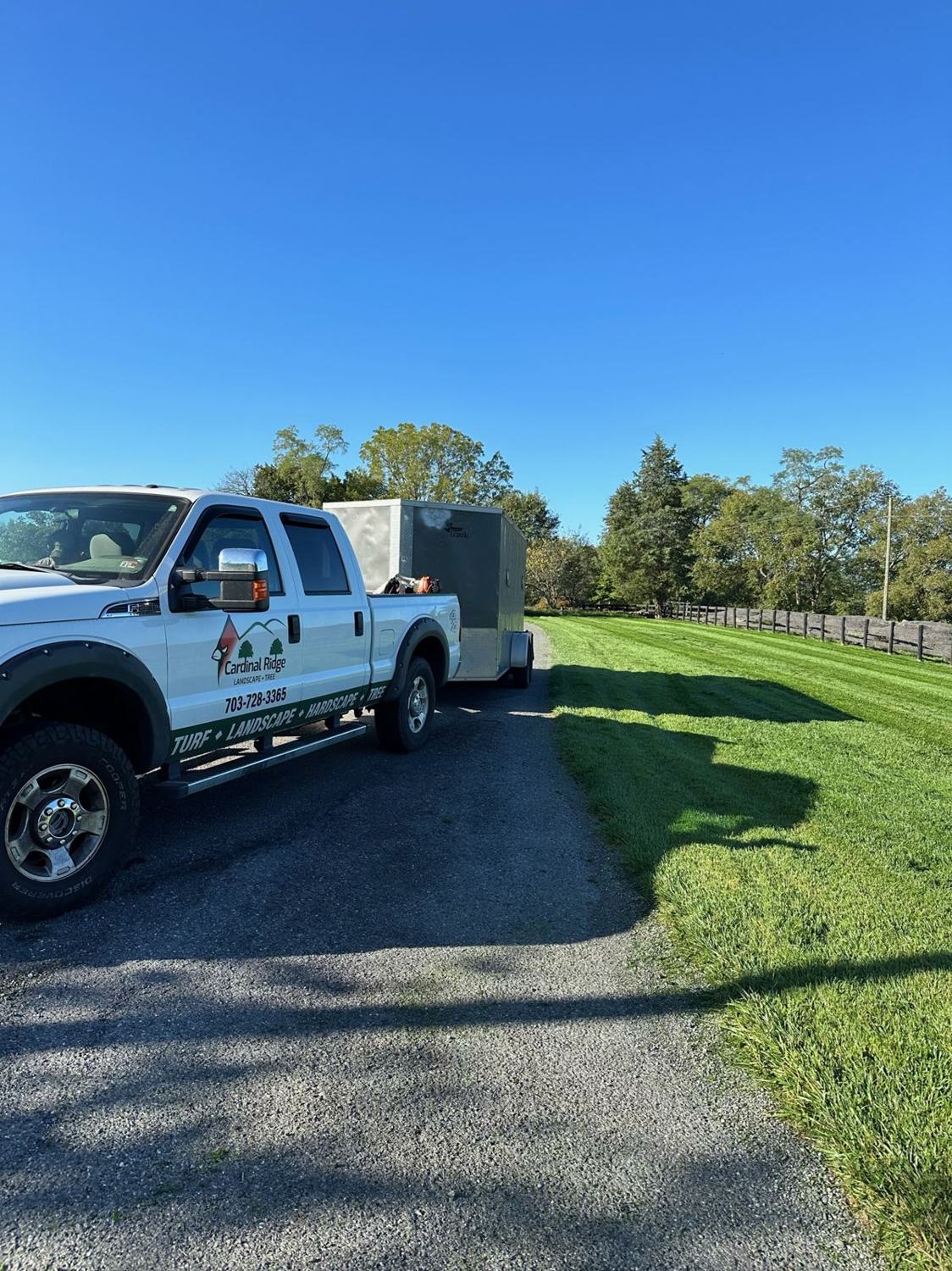 Cardinal Ridge truck with logo and phone number on the door